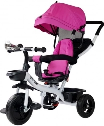 Dětská tříkolka s růžovým přehozem