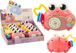 Růžový interaktivní krab s projektorem a chrastítkem na baterie