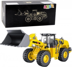 Kovový model nakladače HUINA 1:50 žlutý