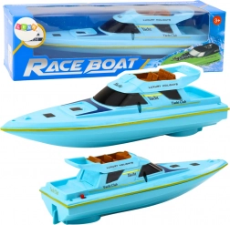 Modrá motorová loďka na baterie