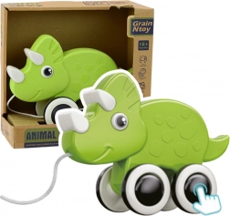 Zelený dinozaur na tahání s píšťalkou