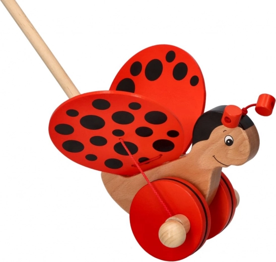 Dřevěný pchací brouček beruška na tyči