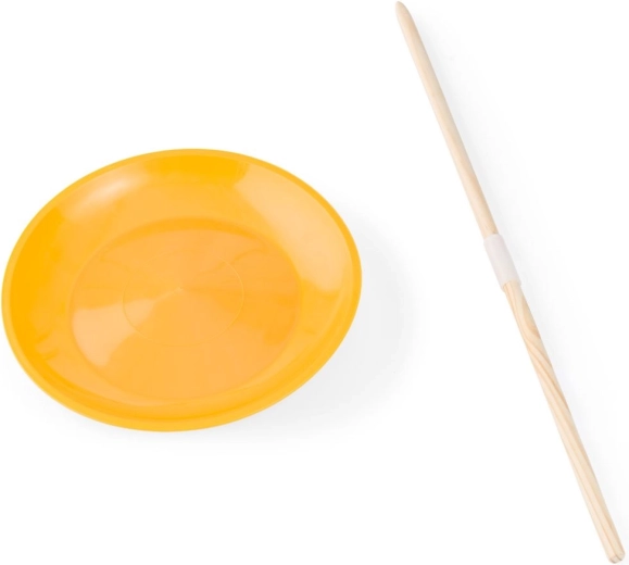 Točící cirkusový talíř se dřevěnou tyčí