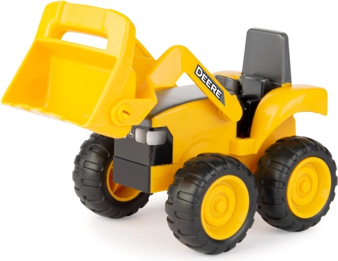 Traktor/nakladač pro nabírání a přesun materiálu