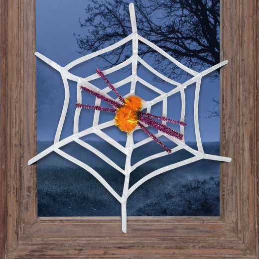 Bílá halloweenská pavučina se žlutým pavoukem