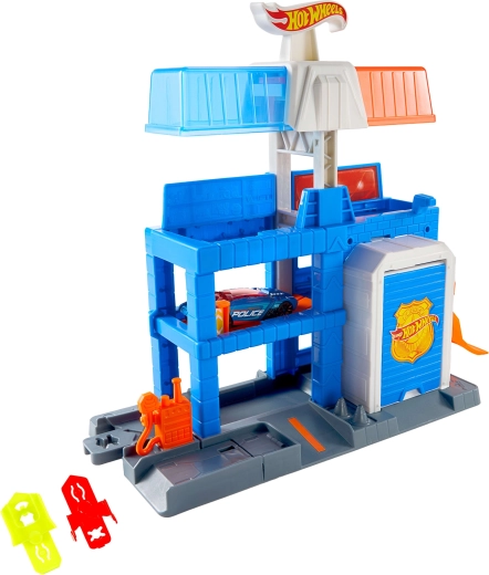 Kovový policejní vůz 1:64 součástí