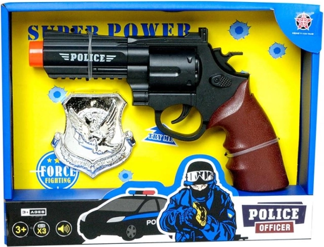 Policejní pistole s odznakem PLEJO