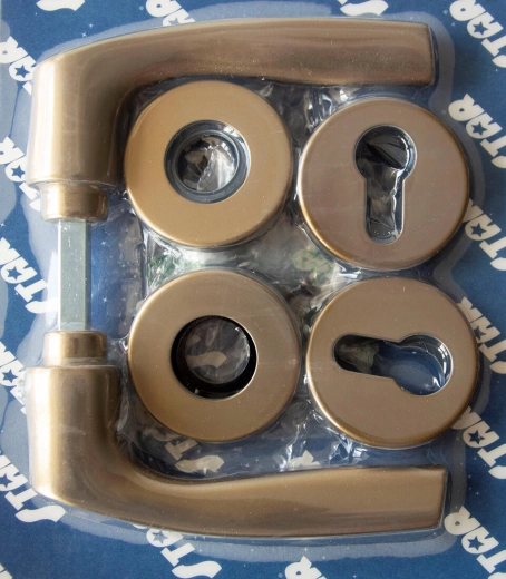 Dveřní kování MONET na rozetě, cylindrická vložka, bronz elox