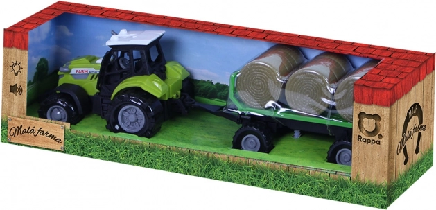 Traktor se zvukem a světlem s vlečkou a balíky slámy