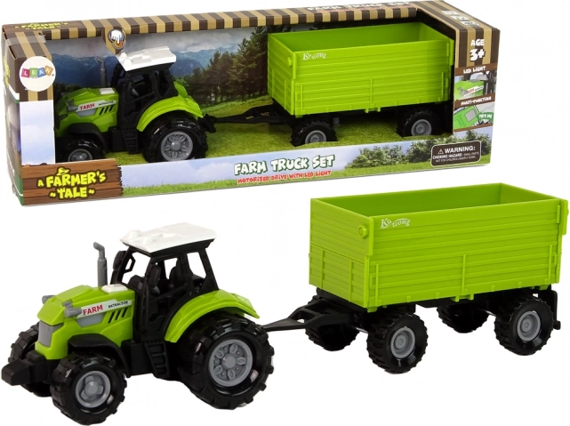 Zelený traktor s přívěsem se světly a zvuky