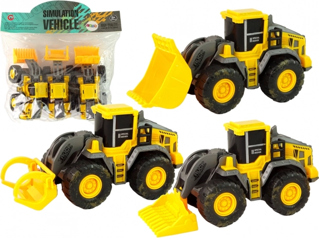 Sada tří žlutých stavebních vozidel