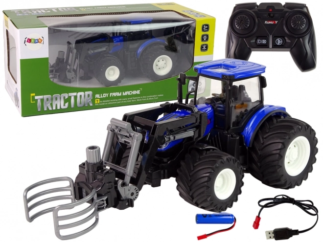 Dálkově ovládaný traktor s drapákem Blue