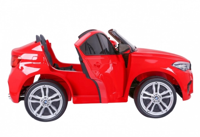 BMW X6M XXL pro 2 děti Červená + dálkové ovládání + eko kůže + bezpečnostní pásy + pomalý rozjezd + MP3 USB + LED dioda