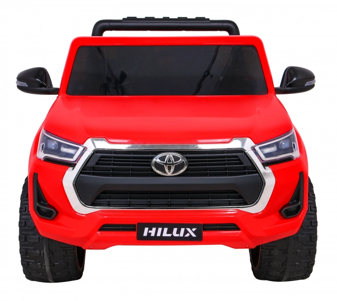 Toyota Hilux baterie pro děti Červená + pohon 4x4 + dálkové ovládání + 2 nosiče zavazadel + rádio MP3 + LED dioda