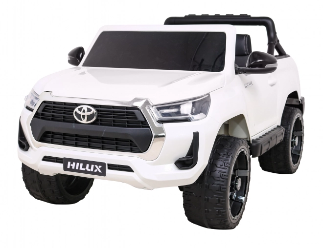 Toyota Hilux baterie pro děti Bílá + pohon 4x4 + dálkové ovládání + 2 nosiče zavazadel + rádio MP3 + LED dioda