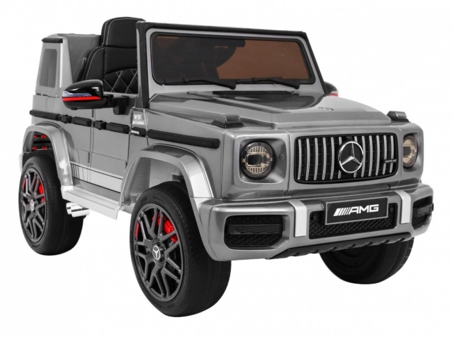 Mercedes AMG G63 pro děti Stříbrný lak + dálkové ovládání + MP3 LED + pomalý start + EVA + pásy