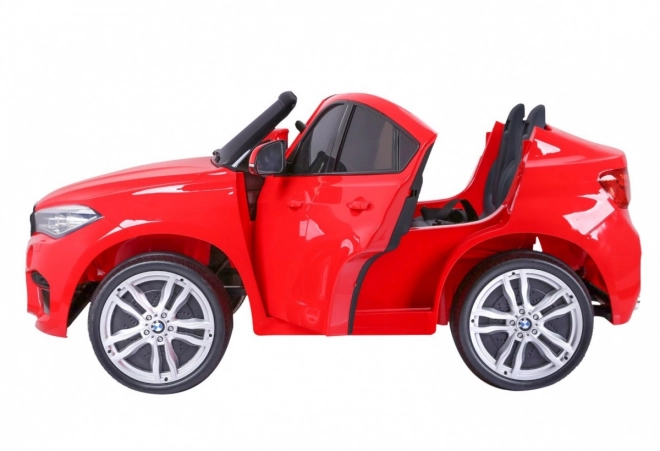 BMW X6M XXL pro 2 děti Červená + dálkové ovládání + eko kůže + bezpečnostní pásy + pomalý rozjezd + MP3 USB + LED dioda