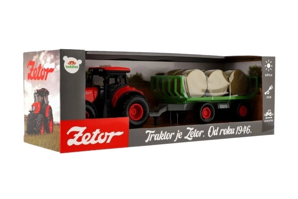 Traktor se zvukem a světlem s odpojitelným vlekem a balíky sena