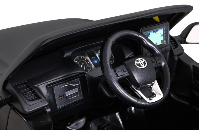 Toyota Hilux baterie pro děti černá + pohon 4x4 + dálkové ovládání + 2 nosiče zavazadel + rádio MP3 + LED dioda