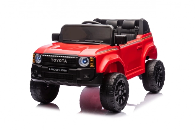 Czerwony pojazd Toyota Land Cruiser Prado