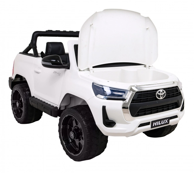 Toyota Hilux baterie pro děti Bílá + pohon 4x4 + dálkové ovládání + 2 nosiče zavazadel + rádio MP3 + LED dioda