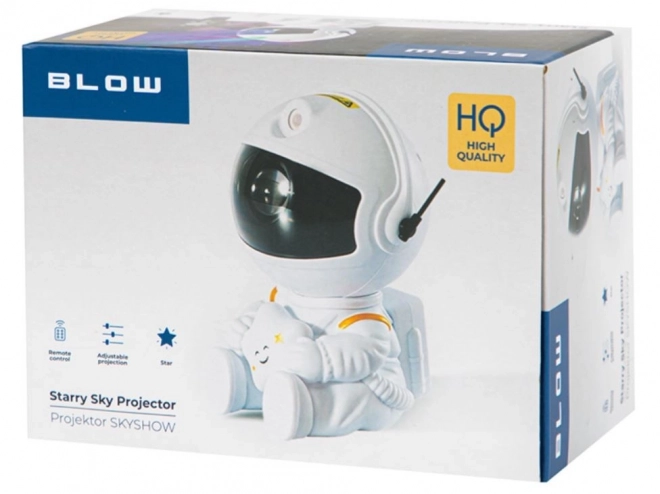 Hvězdný projektor sedící astronaut s dálkovým ovládáním