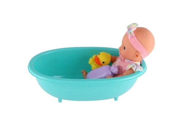 Panenka miminko 26cm pevné tělo plast s vaničkou s doplňky v krabici 20x33x10cm