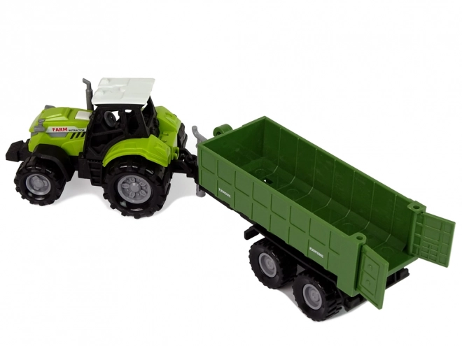Traktor s odpojitelným přívěsem zelený
