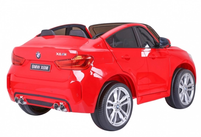 BMW X6M XXL pro 2 děti Červená + dálkové ovládání + eko kůže + bezpečnostní pásy + pomalý rozjezd + MP3 USB + LED dioda