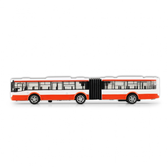Kovový červený kloubový autobus