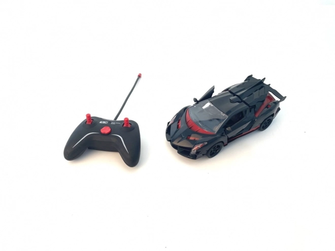 Sportovní RC auto červenočerné v měřítku 1:18