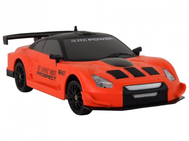 Dálkově ovládané R/C sportovní auto 1:24 Oranžová vyměnitelná kola
