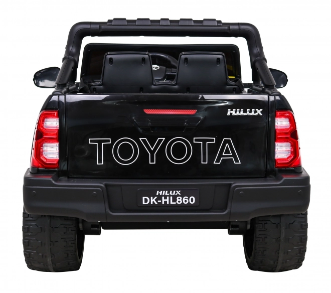 Toyota Hilux baterie pro děti černá + pohon 4x4 + dálkové ovládání + 2 nosiče zavazadel + rádio MP3 + LED dioda
