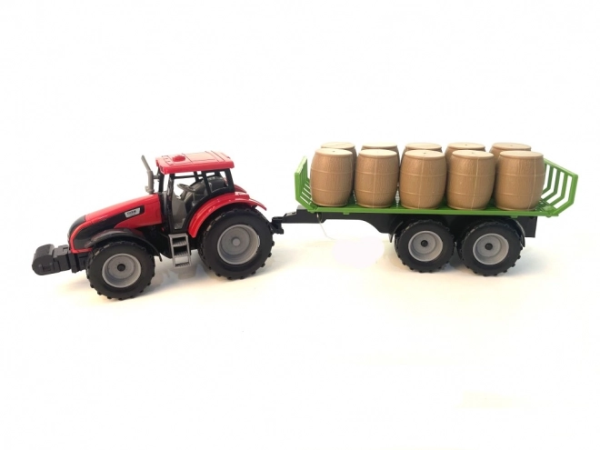 Traktor se setrvačníkem a přívěsem plným sena