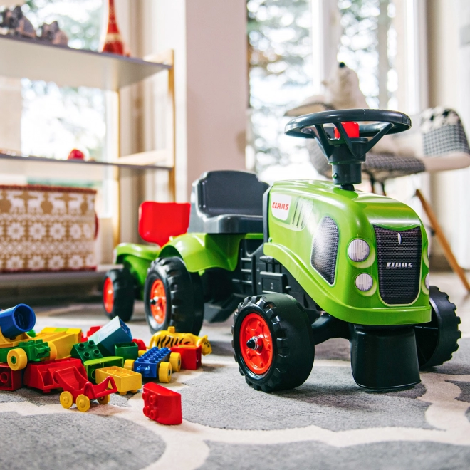 Odstrkovadlo traktor Claas zelené s volantem a valníkem