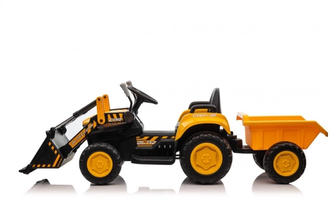 Elektrický traktor s lžící žlutý