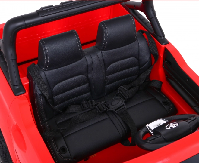 Toyota Hilux baterie pro děti Červená + pohon 4x4 + dálkové ovládání + 2 nosiče zavazadel + rádio MP3 + LED dioda