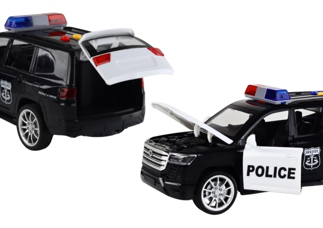 Policejní auto s efekty, otevíracími dveřmi a měřítkem 1:14