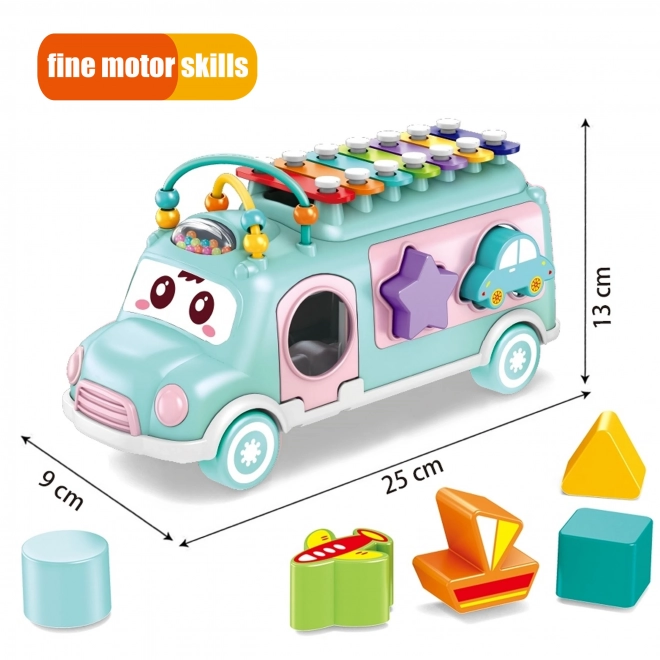 Woopie muzicírovací auto se zeleným sorterem a xylofonem