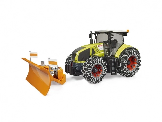 Traktor Claas Axion 950 se sněhovými řetězy a radlicí