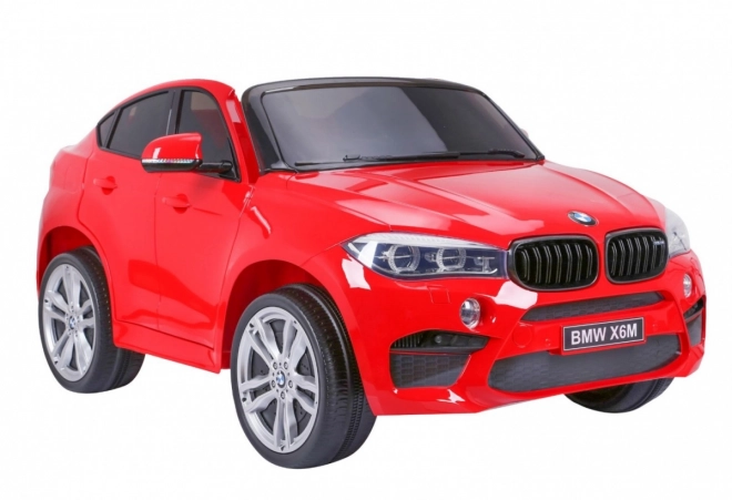 BMW X6M XXL pro 2 děti Červená + dálkové ovládání + eko kůže + bezpečnostní pásy + pomalý rozjezd + MP3 USB + LED dioda