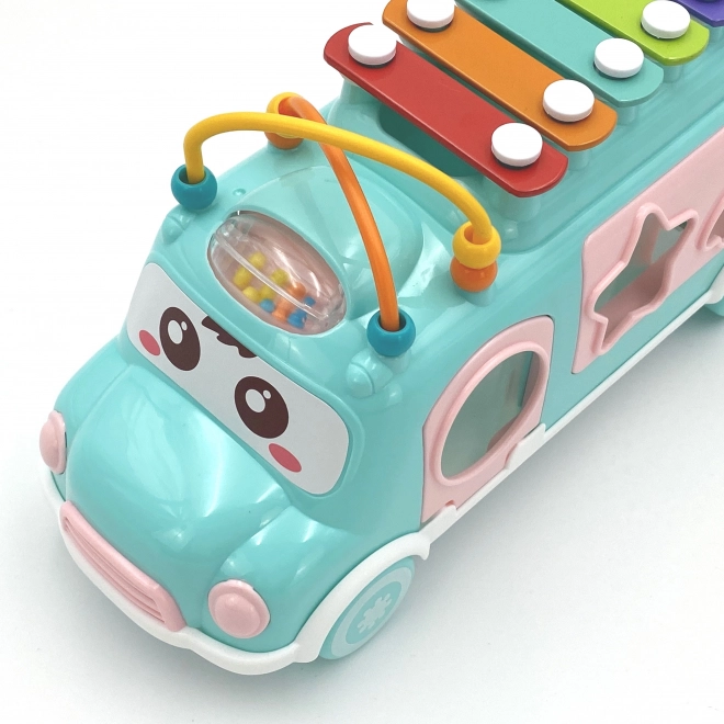 Woopie muzicírovací auto se zeleným sorterem a xylofonem