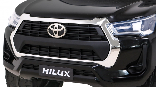 Toyota Hilux baterie pro děti černá + pohon 4x4 + dálkové ovládání + 2 nosiče zavazadel + rádio MP3 + LED dioda