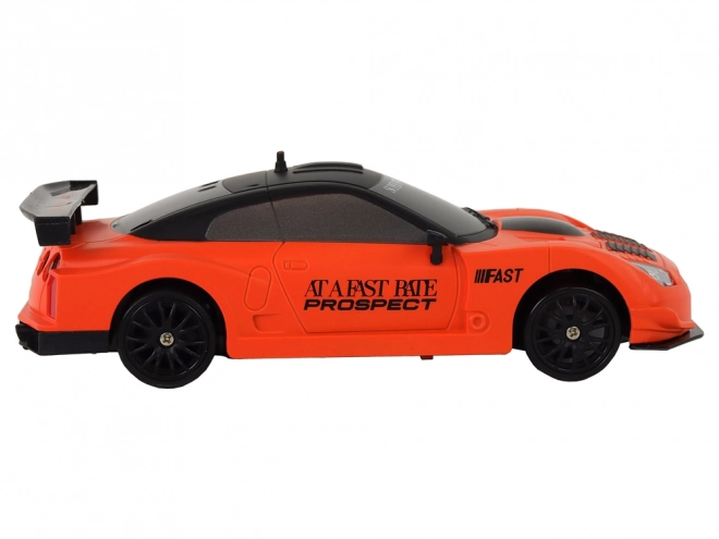 Dálkově ovládané R/C sportovní auto 1:24 Oranžová vyměnitelná kola