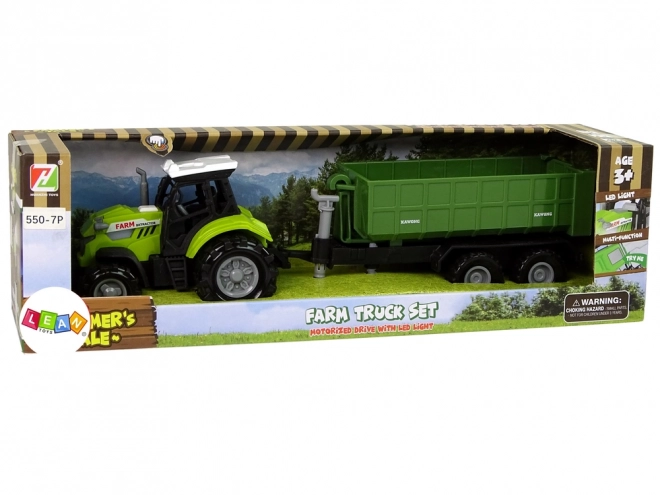 Traktor s odpojitelným přívěsem zelený