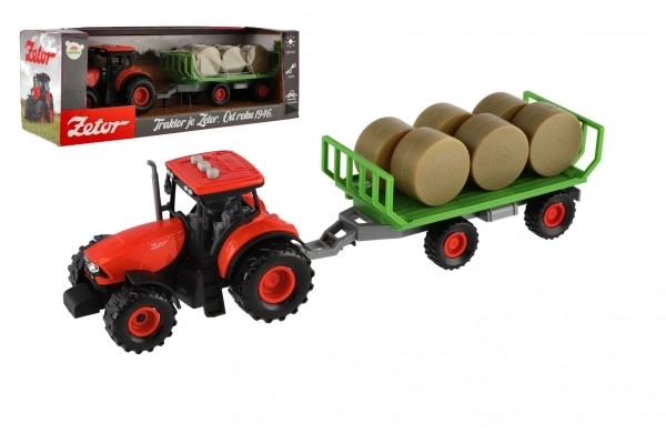 Traktor se zvukem a světlem s odpojitelným vlekem a balíky sena