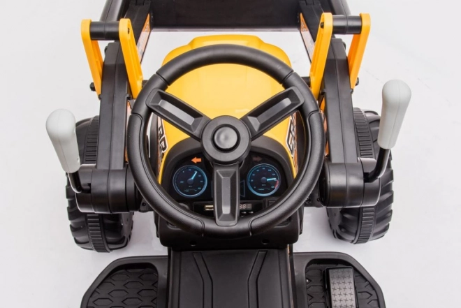Elektrický traktor s lžící žlutý