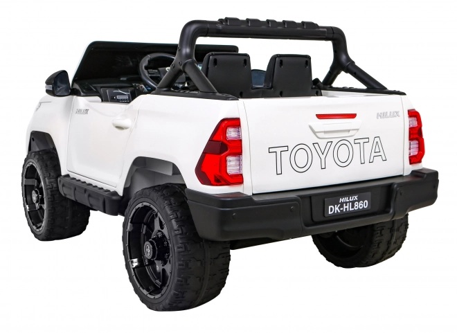 Toyota Hilux baterie pro děti Bílá + pohon 4x4 + dálkové ovládání + 2 nosiče zavazadel + rádio MP3 + LED dioda