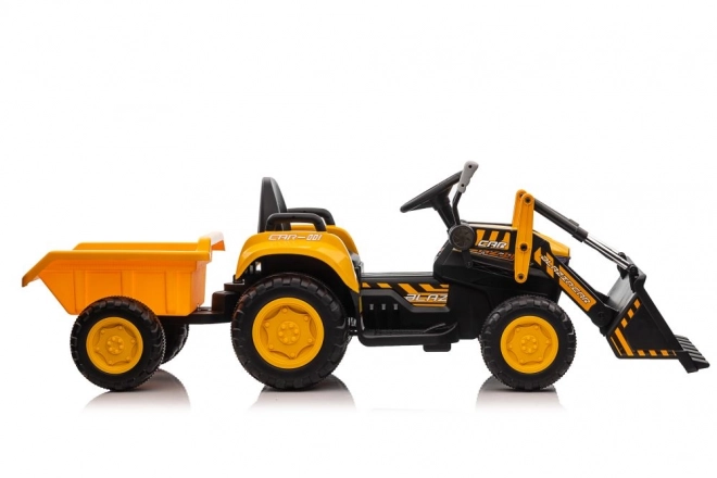 Elektrický traktor s lžící žlutý