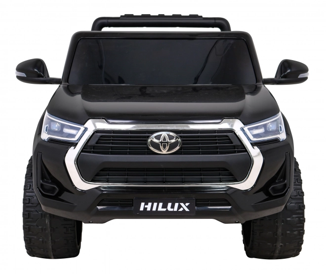 Toyota Hilux baterie pro děti černá + pohon 4x4 + dálkové ovládání + 2 nosiče zavazadel + rádio MP3 + LED dioda